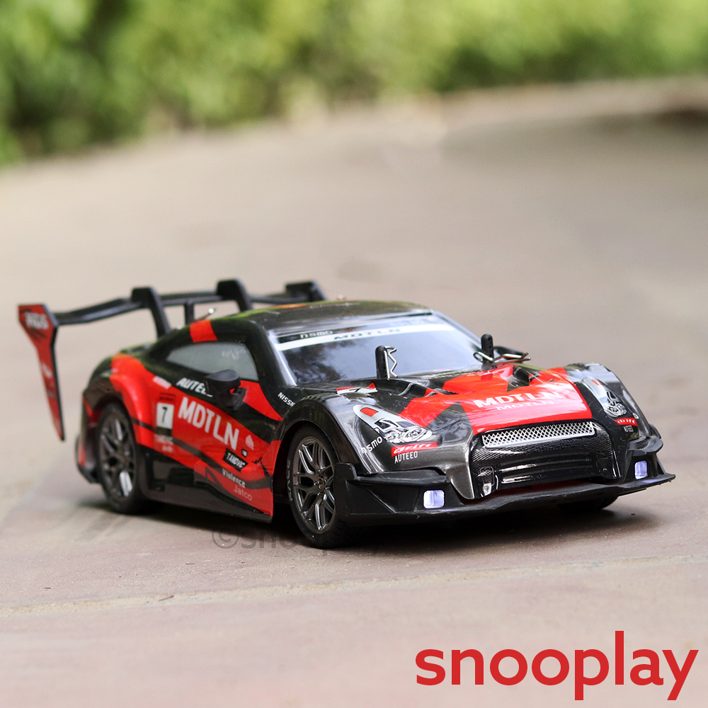 Remote Control 4x4 Drift Racing Car with 4 Spare Wheels - 2.4GHz Frequency, Light & Sound | 1:16 Scale (5-12 Years) | Assorted Colors
